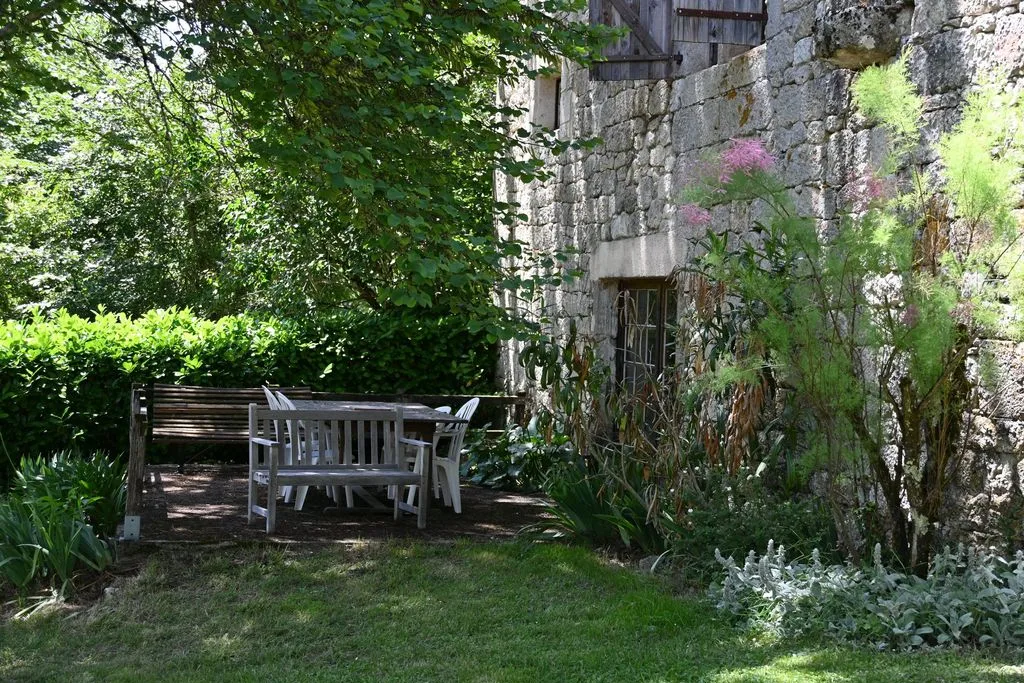 A bench in the shade of the north wall